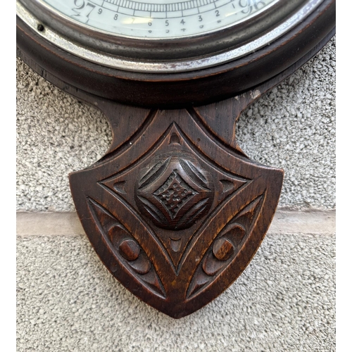 40 - An early 20th century carved oak cased barometer - approx. 78cm high x 26cm wide