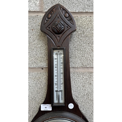 40 - An early 20th century carved oak cased barometer - approx. 78cm high x 26cm wide