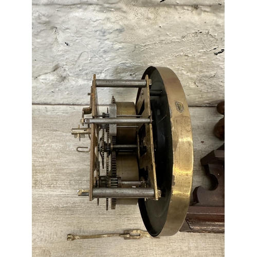 43 - A late 19th/early 20th century walnut cased chiming wall clock with pendulum and key - approx. 85cm ... 