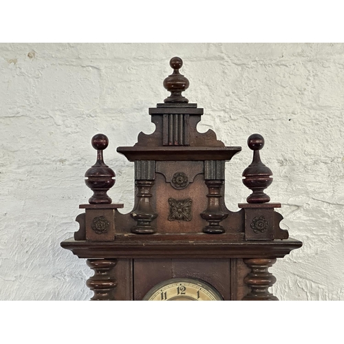 43 - A late 19th/early 20th century walnut cased chiming wall clock with pendulum and key - approx. 85cm ... 