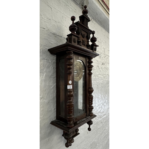 43 - A late 19th/early 20th century walnut cased chiming wall clock with pendulum and key - approx. 85cm ... 