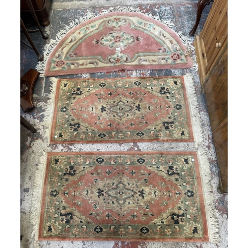 46 - Three rugs, two Oushak style pink ground - approx. 130cm x 62cm and one Chinese pink floral - approx... 