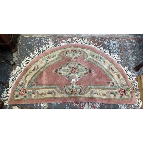 46 - Three rugs, two Oushak style pink ground - approx. 130cm x 62cm and one Chinese pink floral - approx... 