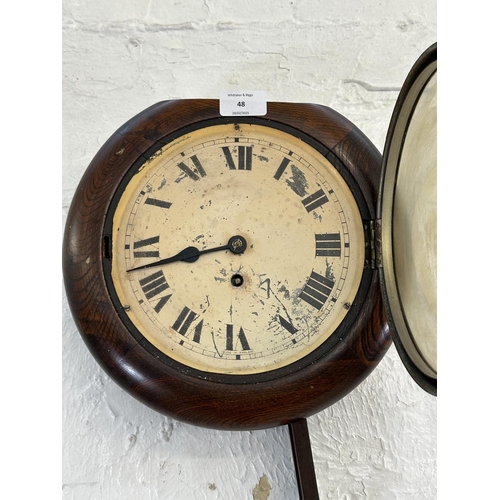 48 - A 19th century oak cased wall clock with pendulum and key - approx. 28cm high x 29cm wide