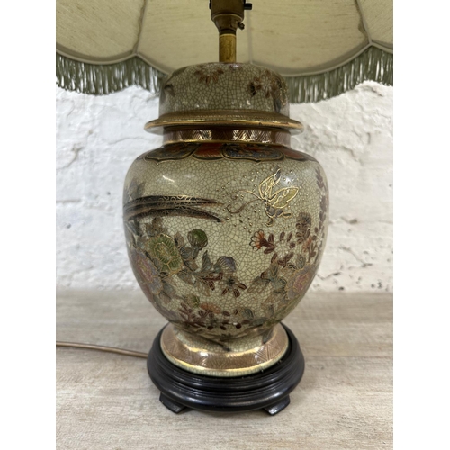 49 - A Chinese porcelain table lamp on wooden stand - approx. 66cm high including shade