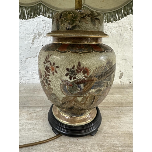 49 - A Chinese porcelain table lamp on wooden stand - approx. 66cm high including shade