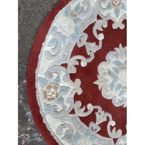 52 - A Flair Rugs Lotus Premium Aubusson red ground floral pattern rug - approx. 120cm diameter