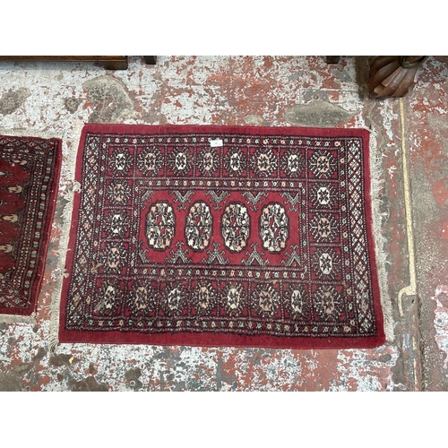 54 - Three mid 20th century Bokhara rugs - largest approx. 97cm x 65cm