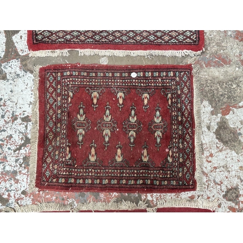 54 - Three mid 20th century Bokhara rugs - largest approx. 97cm x 65cm