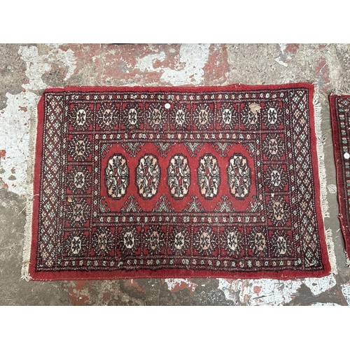 54 - Three mid 20th century Bokhara rugs - largest approx. 97cm x 65cm