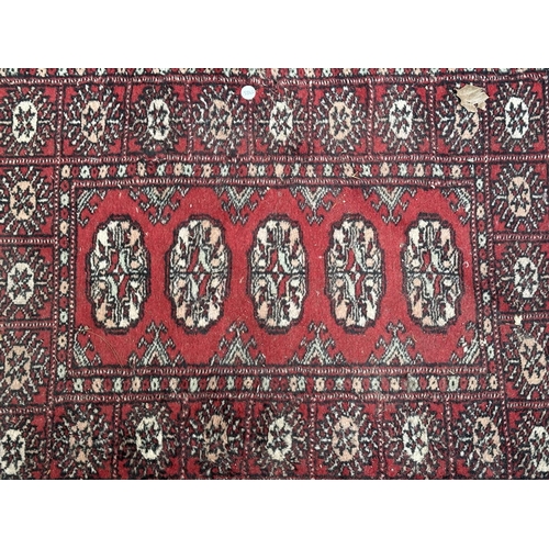 54 - Three mid 20th century Bokhara rugs - largest approx. 97cm x 65cm