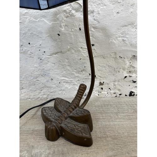 56 - A Tiffany style stained glass and bronzed dragonfly desk lamp - approx. 33cm high