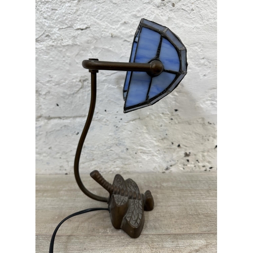 56 - A Tiffany style stained glass and bronzed dragonfly desk lamp - approx. 33cm high