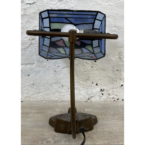 56 - A Tiffany style stained glass and bronzed dragonfly desk lamp - approx. 33cm high