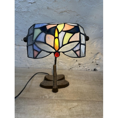 56 - A Tiffany style stained glass and bronzed dragonfly desk lamp - approx. 33cm high