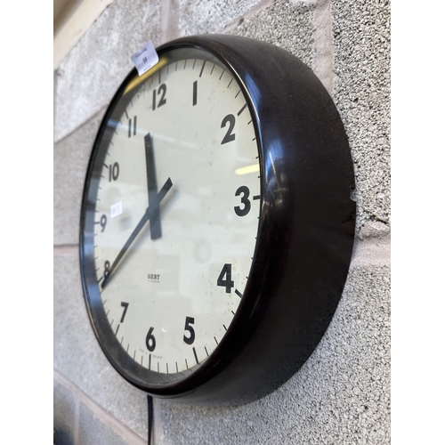 59 - A mid 20th century Gent of Leicester black plastic cased circular electric wall clock - approx. 36cm... 