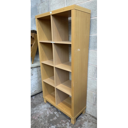 63 - An IKEA beech effect shelving unit - approx. 172cm high x 85cm wide x 36cm deep