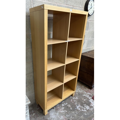 63 - An IKEA beech effect shelving unit - approx. 172cm high x 85cm wide x 36cm deep