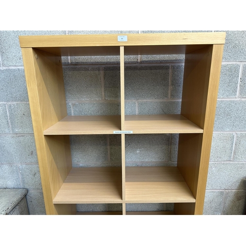 63 - An IKEA beech effect shelving unit - approx. 172cm high x 85cm wide x 36cm deep