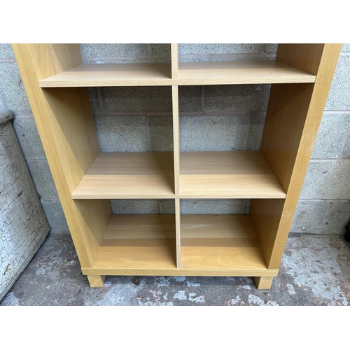 63 - An IKEA beech effect shelving unit - approx. 172cm high x 85cm wide x 36cm deep