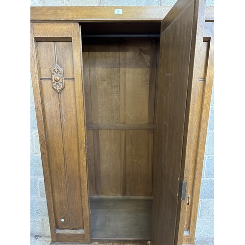 67 - An early 20th century carved oak mirror door wardrobe - approx. 196cm high x 100cm wide x 47cm deep