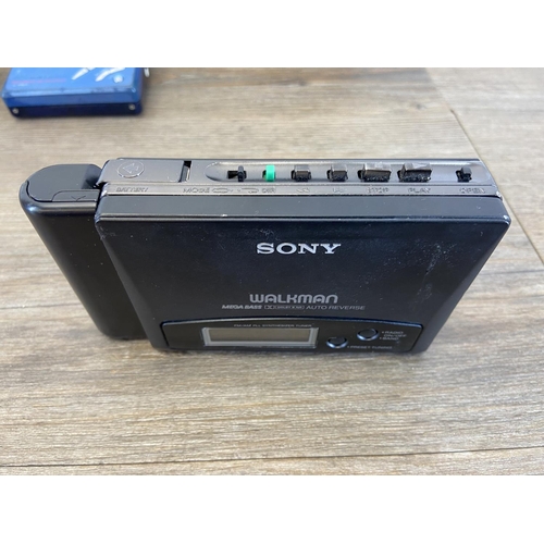 753 - Four items, one Sony Walkman personal minidisc recorder, one cased Sony Walkman WM-AF605 personal ra... 