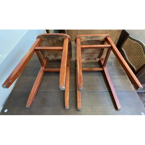 79 - Two mid 20th century stained beech and white vinyl stools - approx. 53cm high x 32cm wide x 32cm dee... 