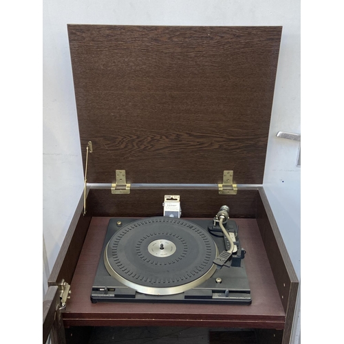 81 - An oak effect stereo cabinet containing BSR Precision turntable