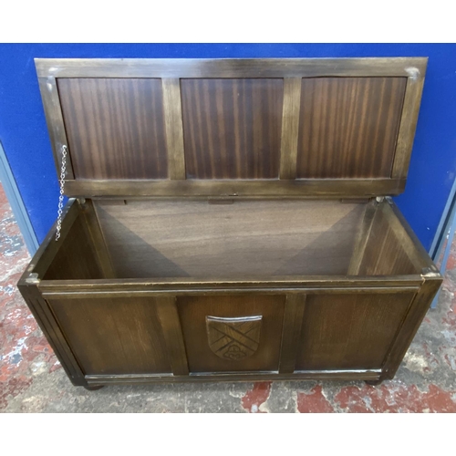 82 - A mid 20th century carved oak blanket box - approx. 52cm high x 99cm wide x 43cm deep