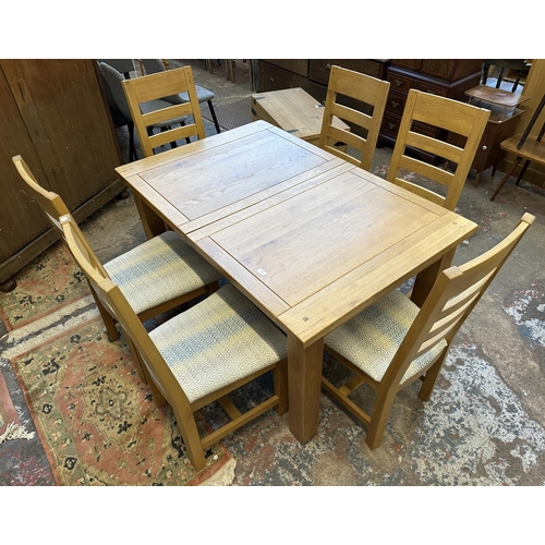 89 - A modern solid oak extending dining table and six chairs - approx. 78cm high x 90cm wide x 140cm lon... 