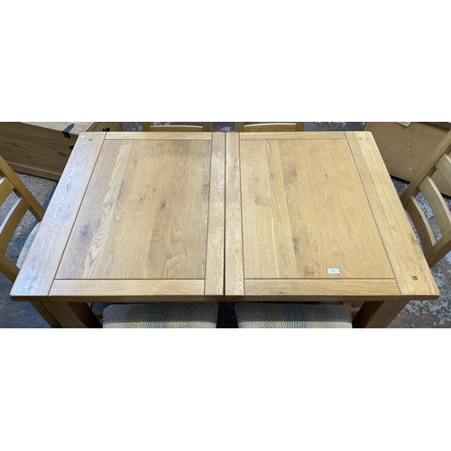 89 - A modern solid oak extending dining table and six chairs - approx. 78cm high x 90cm wide x 140cm lon... 