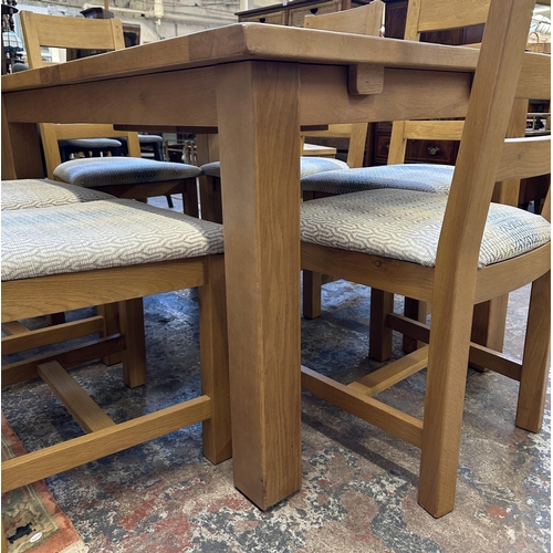 89 - A modern solid oak extending dining table and six chairs - approx. 78cm high x 90cm wide x 140cm lon... 