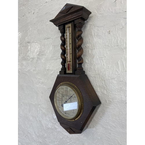 91A - An early 20th century Short & Mason London oak barley twist cased barometer - approx. 50cm high