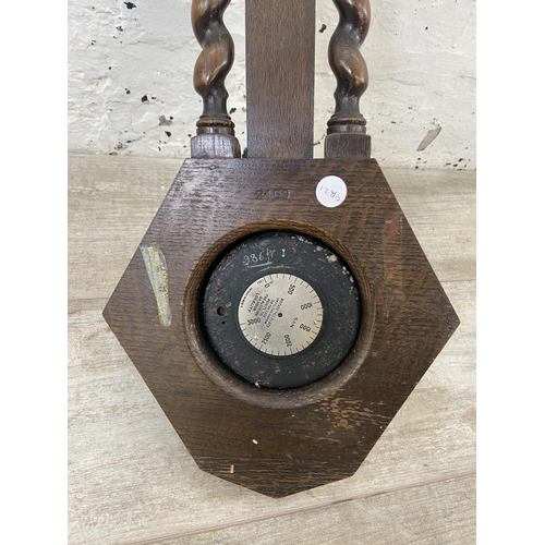 91A - An early 20th century Short & Mason London oak barley twist cased barometer - approx. 50cm high