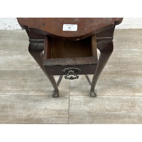 94 - An Edwardian mahogany serpentine two tier side table - approx. 77cm high x 64cm wide x 40cm deep