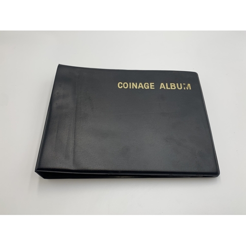 2387 - A coin album containing world coins, hammered silver coins, tokens and medallions to include 50% sil... 