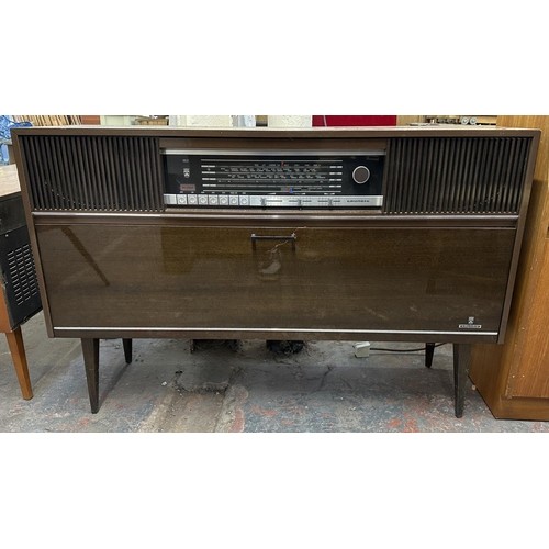 755 - A mid 1970s Grundig Mandello 8 solid state radiogram comprising four-speed turntable and four-band r... 