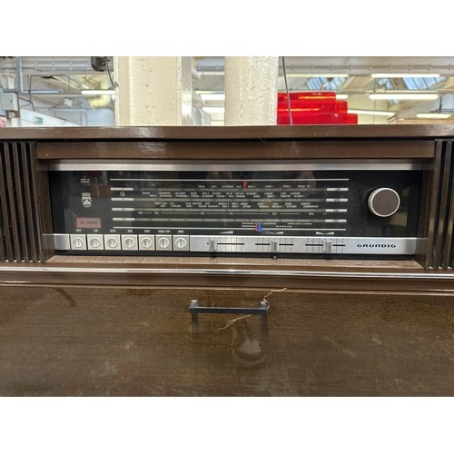 755 - A mid 1970s Grundig Mandello 8 solid state radiogram comprising four-speed turntable and four-band r... 