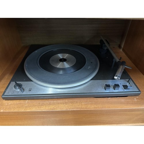 755 - A mid 1970s Grundig Mandello 8 solid state radiogram comprising four-speed turntable and four-band r... 