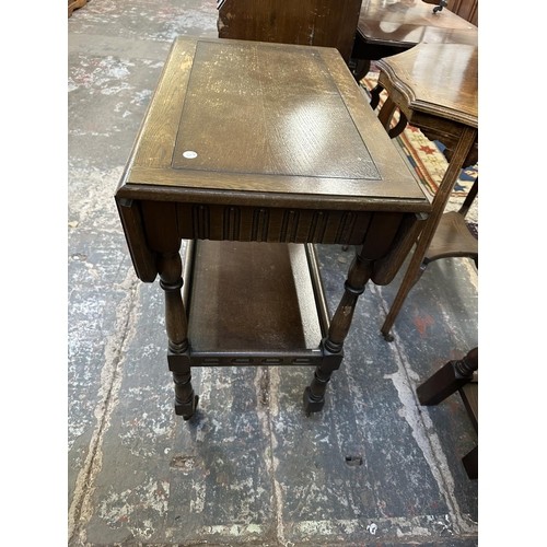 125 - Three pieces of furniture, one Edwardian mahogany piano stool, one oak drop leaf tea trolley and one... 