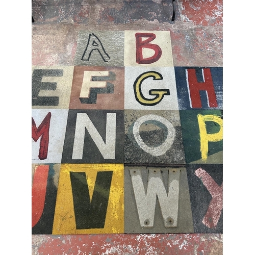 3 - A complete set of twenty six Sharon Elphick alphabetical carpet tiles - each approx. 46cm square