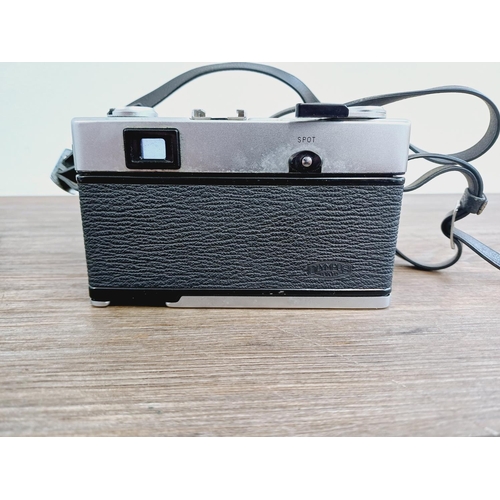 955 - A cased Olympus 35 SP spot and center-weighted metering 35mm rangefinder camera fitted with G. Zuiko... 