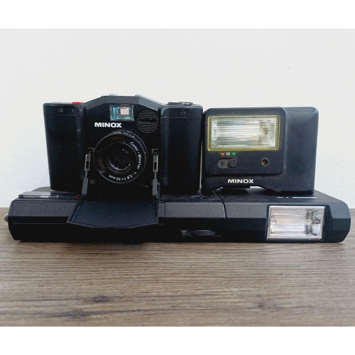 957 - Two Minox cameras, one EL 35 ultra-compact 35mm camera fitted with FC35 flash and one 110S for 110 f... 