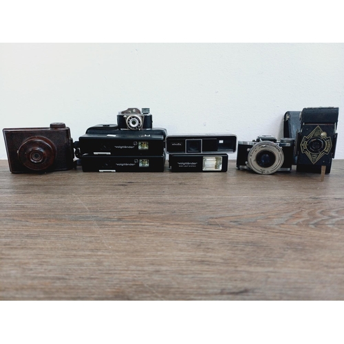 958 - Eight miniature cameras to include Minolta-16, two cased Voigtländer Vitoret 110 EL, Ensign Midget, ... 