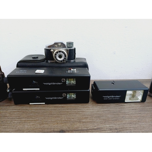 958 - Eight miniature cameras to include Minolta-16, two cased Voigtländer Vitoret 110 EL, Ensign Midget, ... 