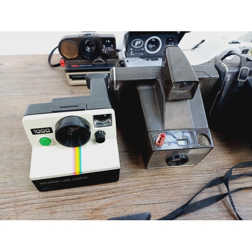 948 - Twelve instant cameras to include Fujifilm Instax 100, Polaroid The Button, Polaroid P, Kodak EK2, P... 