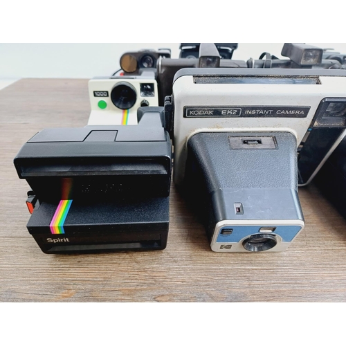 948 - Twelve instant cameras to include Fujifilm Instax 100, Polaroid The Button, Polaroid P, Kodak EK2, P... 