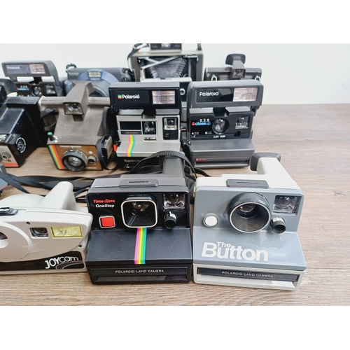 950 - Twelve instant cameras to include Fujifilm Instax 100, Polaroid The Button, Polaroid 636 Close-Up, P... 