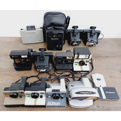 952 - Twelve instant cameras to include Polaroid The Button, Polaroid P, Kodak EK160, Polaroid Land camera... 