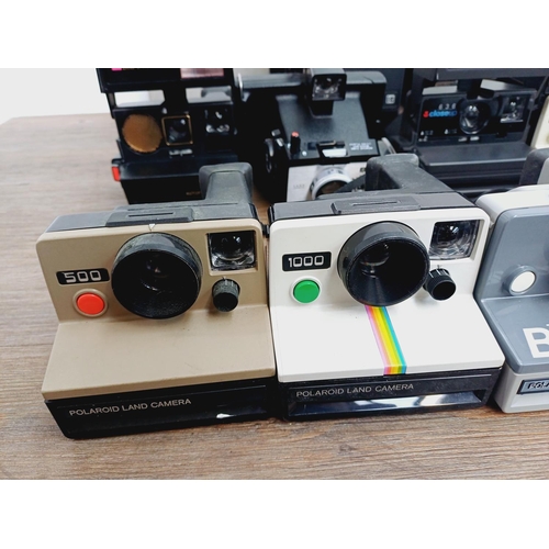 952 - Twelve instant cameras to include Polaroid The Button, Polaroid P, Kodak EK160, Polaroid Land camera... 